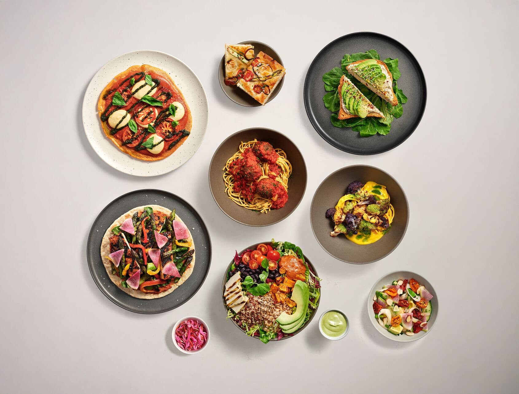 Variety of chef-crafted, plant-based dishes, showcasing bright, vibrant locally-sourced vegetables.